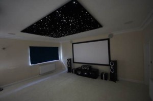 A fibre optic star ceiling, starry sky ceiling, set of star ceiling panels, fixed below the plasterboard ceiling of a room and illuminated 